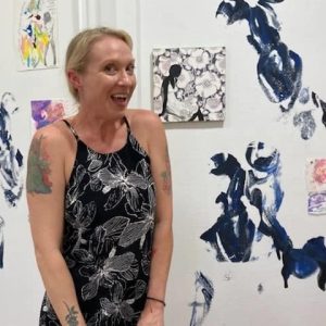 woman in front of art 