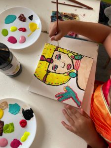 hands and a painting