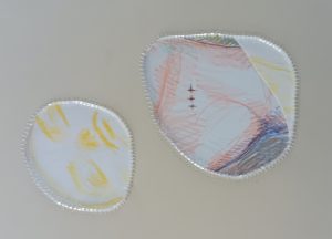 two holes with parts of a body in colored pencil